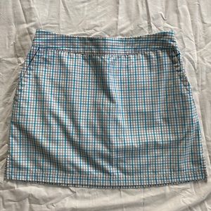 Adidas golf skort white plaid with light grey and turquoise.